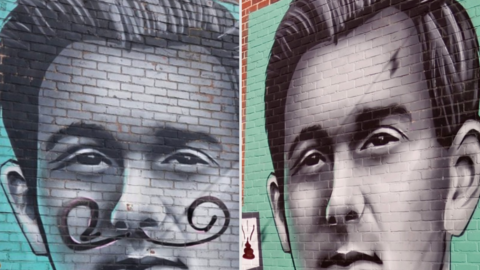 On the right is a photo of the painting of the man on a brick wall as it looked before it was defaced, with the image on the left showing the painting after it was vandalised. Jeff Hall is depicted in grey and black and other bricks to the left and right of his head are green.