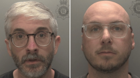 Police custody image of David Drury, who has short grey hair and beard and is wearing glasses and Daniel Sellers who has is bald and has a dark beard