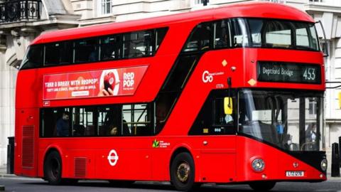 A red double decker London bus.