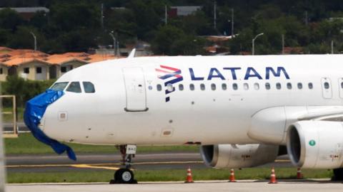 The LATAM plane parked at the Silvio Pettirossi International Airport in Paraguay on 27 October