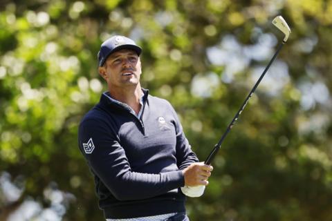 Bryson DeChambeau plays an iron shot during the Masters second round