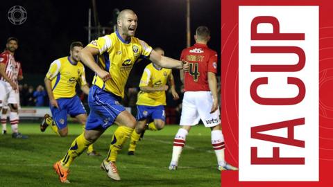 Craig Robinson celebrates scoring for Warrington Town in the FA Cup