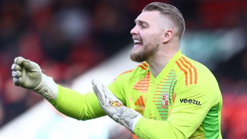 Swindon Town goalkeeper Connor Ripley shouts instructions
