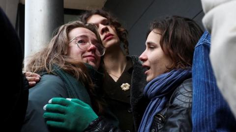 Supporters of Friends of the Earth react outside the court in The Hague after Shell wins the case 