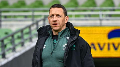 Scott Bemand looks towards the field from the touchline at the Aviva Stadium