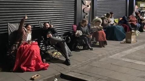 People camping outside estate agents