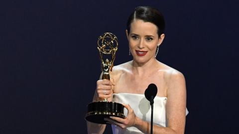 Claire Foy holds the Emmy award she won for The Queen