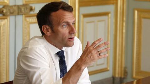 French President Emmanuel Macron attends a video conference at the Elysee Palace in Paris, April 16 2020