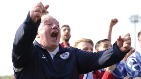 Stevenage boss Steve Evans celebrates promotion