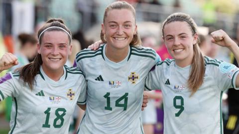 Megan Bell, Lauren Wade and Simone Magill celebrate at full-time