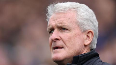 Mark Hughes looks concerned on the sidelines during Carlisle's play-off semi-final defeat by Boreham Wood