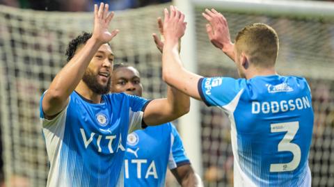 Kyle Wootton celebrates scoring for Stockport in the 4-2 win over Wigan