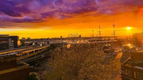 Portsmouth bathed in golden light with a purple sky