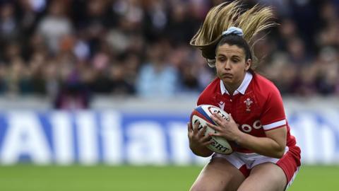 Kayleigh Powell collects the ball during a Wales game