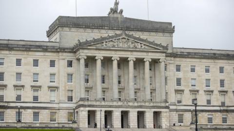 Stormont. It is a large Greek classical style building with six columns at the front.