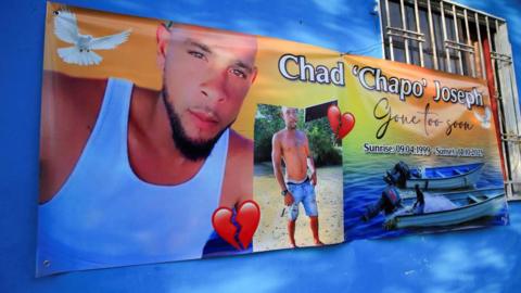 A poster showing Chad Joseph, one of the men believed killed in the US strike