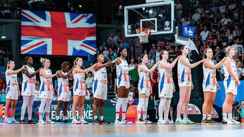 Great Britain players line up for the national anthem before a match against in Hamburg