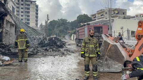 Civil defense and firefighting teams carry out operations on the government building in Nabatieh, Lebanon, on April 10, 2026
