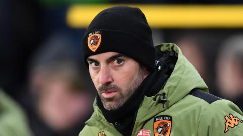 Hull City boss Ruben Selles looks on from the touchline