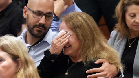 Teresa Robinovitz is consoled after giving her victim impact statement