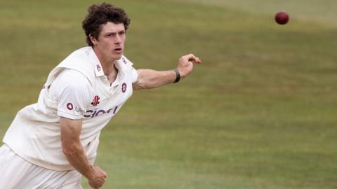 Leg-spinner Calvin Harrison releases the ball while bowling for Northamptonshire this season