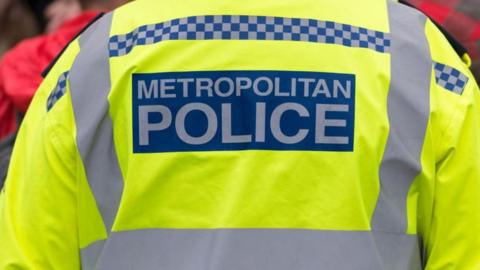 a close up stock image of the back of a uniformed Metropolitan Police officer