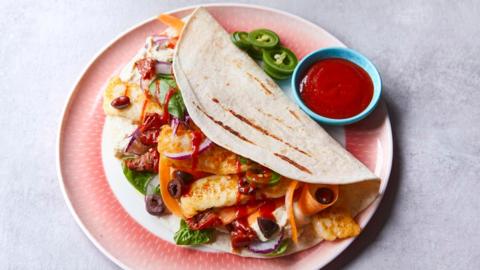 Easy halloumi wrap on a pink plate 