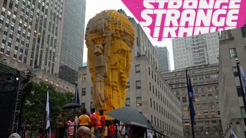 A giant lego World Cup trophy and the Strange News logo