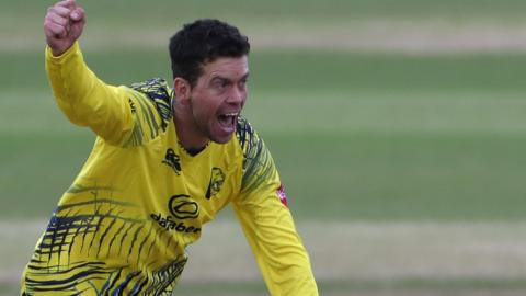 Nathan Sowter celebrates taking a wicket for Durham