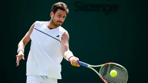 Cameron Norrie hits a forehand