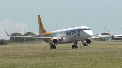 An Aurigny-branded jet landing at Guernsey airport 