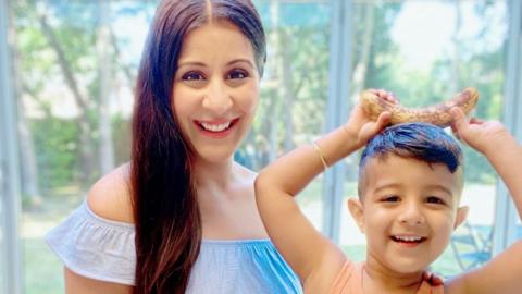 Mother and son, happy and smiling together.