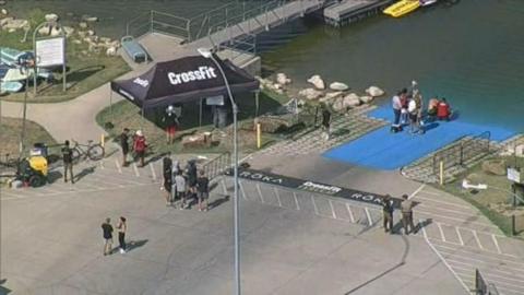 Aerial footage shot from a helicopter shows rescue workers at Marine Creek Lake, Texas, where athlete Lazar Dukic died while taking part in a swimming event