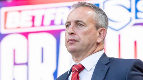 Catalans Dragons head coach Steve McNamara stands before the Grand Final