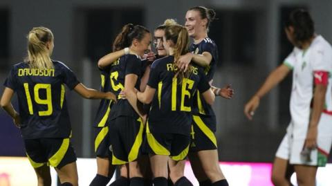 Scotland's Caroline Weir celebrates with her team-mates after scoring