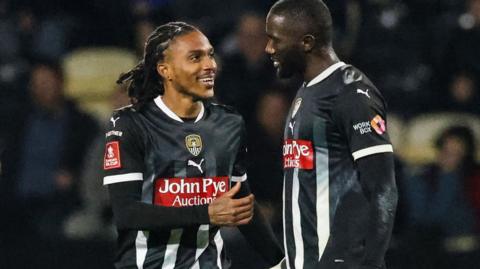 Jevani  Brown and Alassana Jatta celebrate scoring for Notts County