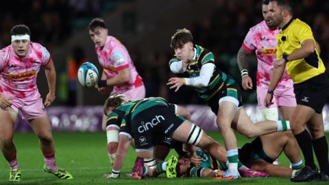 Jonny Weimann passes the ball during the PREM Rugby Cup match between Northampton Saints and Harlequins