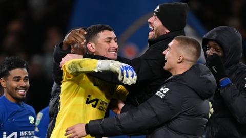 Djordje Petrovic of Chelsea celebrates their sides victory with team mates after saving a penalty taken by Matt Ritchie of Newcastle United (not pictured) following a penalty shoot out in the Carabao Cup quarter-final