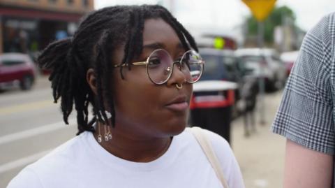 Woman with glasses and nose ring