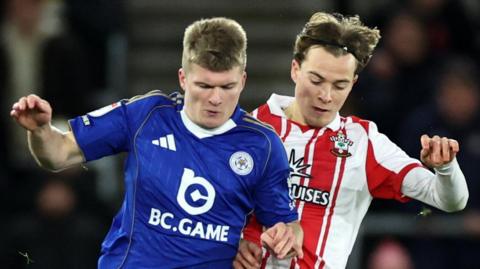 Jordan James of Leicester City (left) in action with Caspar Jander (right) of Southampton