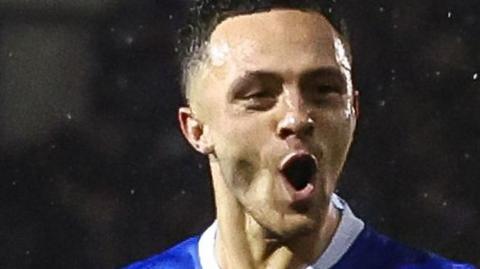 Portsmouth's Jordan Williams celebrating his goal against Millwall