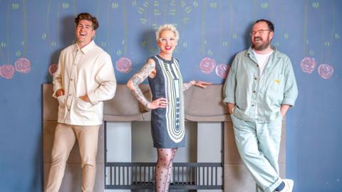Scotland's Home of the Year judges standing against a blue wall