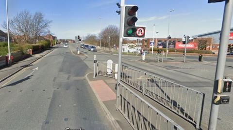 Plymouth Road in Blackpool at a pedestrian crossing at the junction with Mowbray Drive on a sunny day