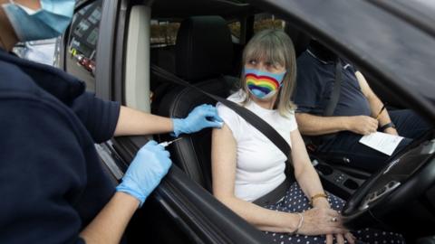 Woman receiving injection