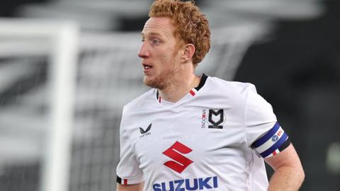 Dean Lewington in action