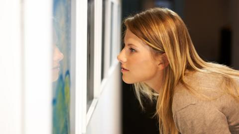 Woman in an art gallery
