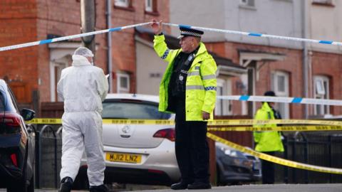 Police and forensic officers at the scene