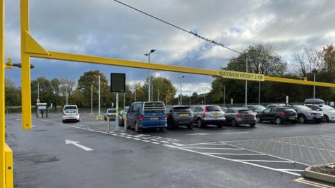 The new Castle Cary station car park where there are many cars parked in spaces