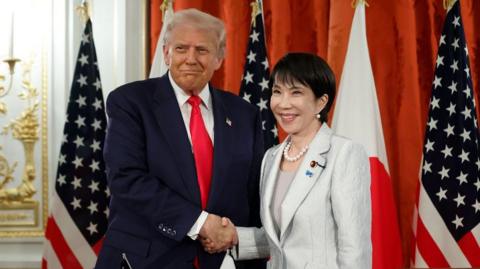 US President Donald Trump and Japan's Prime Minister Sanae Takaichi pose for photographs following a signing ceremony at the Akasaka Palace State Guest House in Tokyo, Japan, 28 October 2025