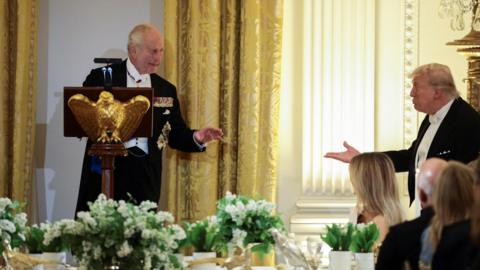 Britain's King Charles and U.S. President Donald Trump interact during a state dinner for Britain's King Charles and Queen Camilla at the White House in Washington, D.C., U.S., April 28, 2026. 